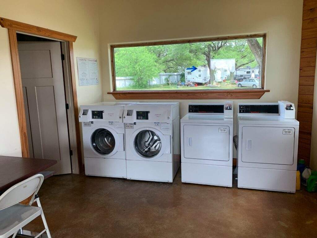 two washers and two dryer in a laundry room at Rising Spirit Rv Park