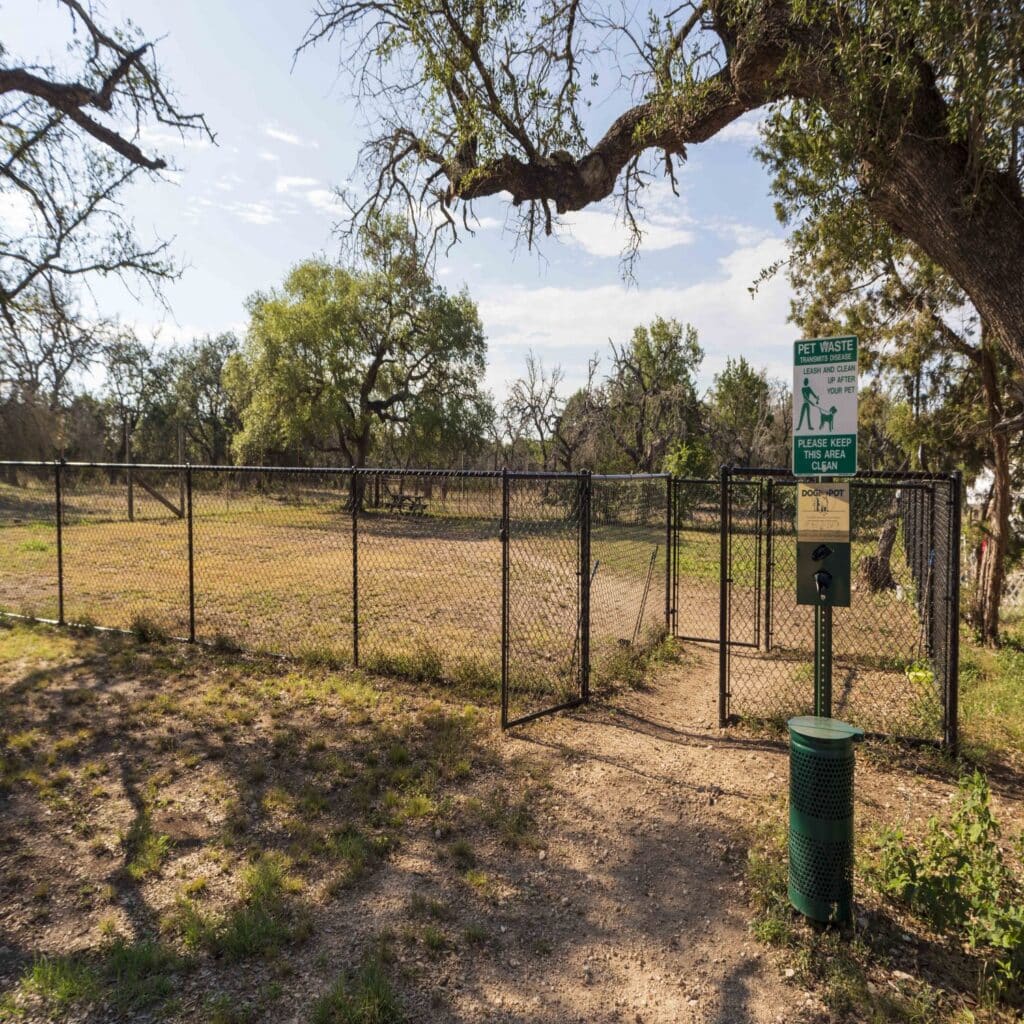 Dog Fenced area with free doggie poop bags at Rising Spirit Rv Park